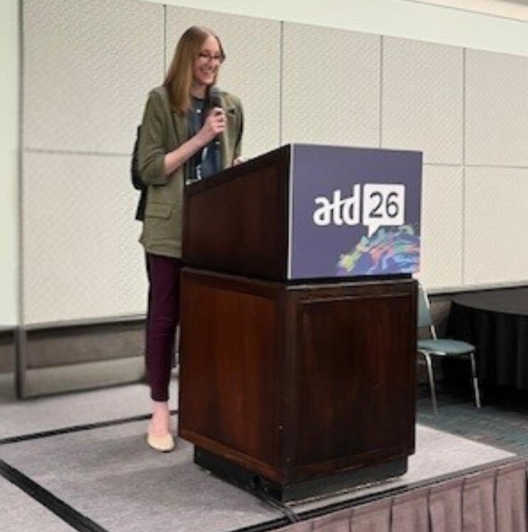 A woman speaks from behind a podium at the ATD Chapter leaders conference, 2026